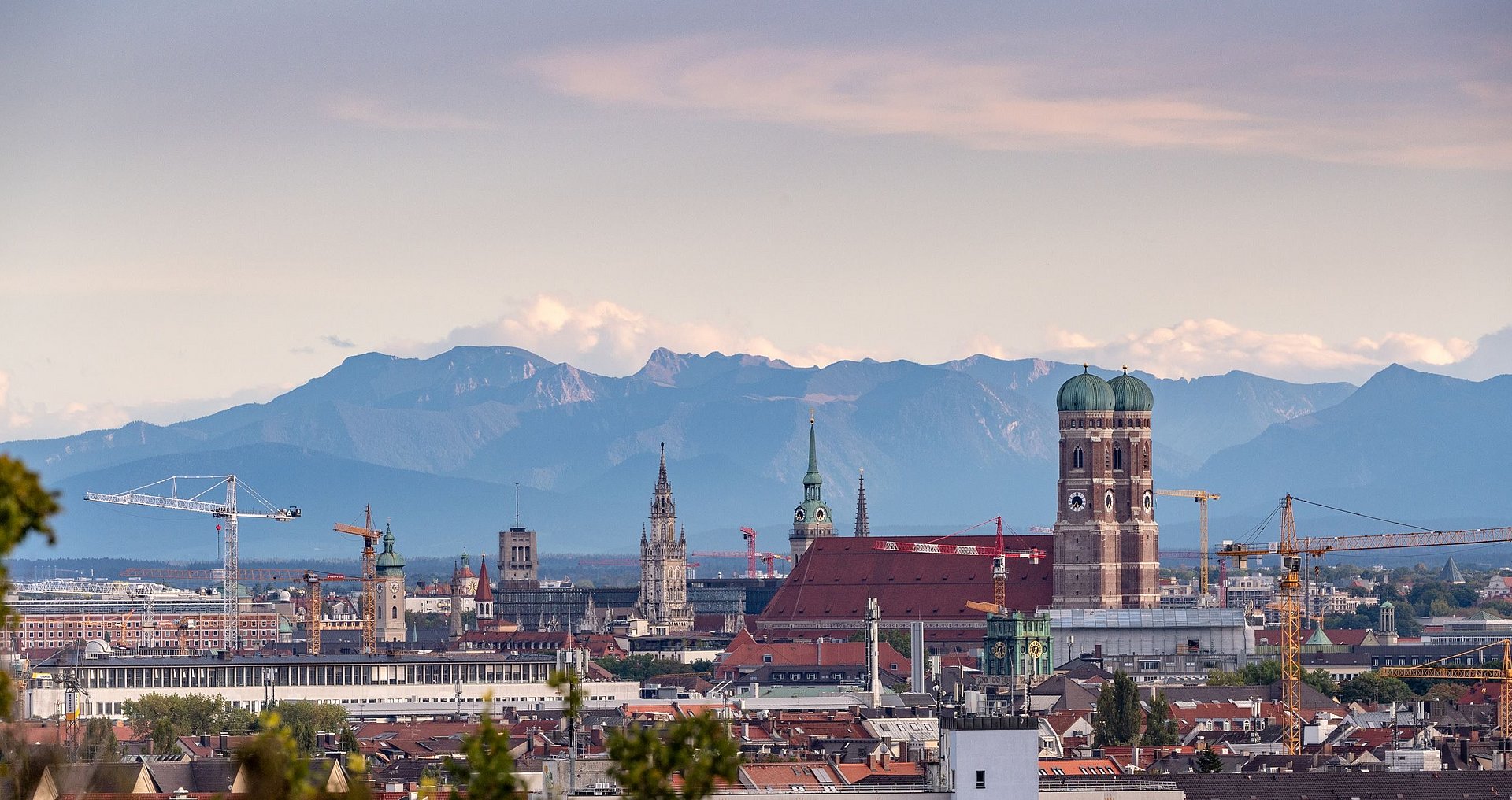 City of Munich with alpine panorama Shot of the city of Munich from above with a panorama of the Alps in the background