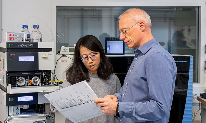 Prof. Küster and a colleague evaluate the results of a data collection.