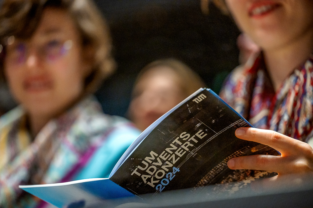 Visitor reading the program booklet